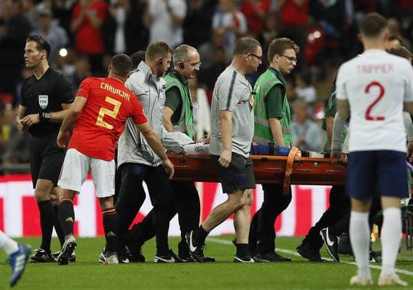 Dani Carvajal of Spain holds out a hand as Luke Shaw of England is stretchered off injured during the UEFA Nations League - League A - Group 4 match at Wembley Stadium, London. Picture date 8th September 2018. Picture credit should read: David Klein Sportimage EDITORIAL USE ONLY. No use with unauthorised audio, video, data, fixture lists, club league logos or live services. Online in-match use limited to 120 images, no video emulation. No use in betting, games or single club league player publications.