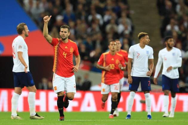 8th September 2018, Wembley Stadium, London, England; UEFA Nations League football, England versus Spain; Nacho of Spain celebrates Saul Niguez s goal making it 1-1 amongst dejected England players  ActionPlus12061088 ShaunxBrooks