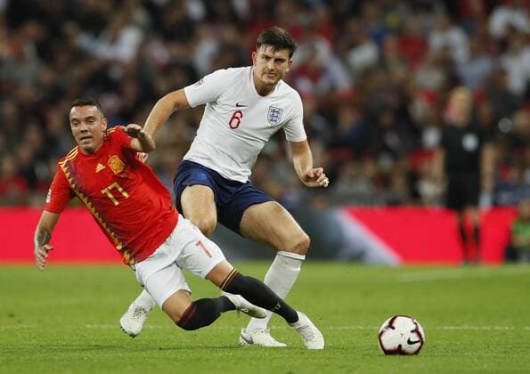 Iago Aspas of Spain tackled by Harry Maguire of England during the UEFA Nations League - League A - Group 4 match at Wembley Stadium, London. Picture date 8th September 2018. Picture credit should read: David Klein Sportimage EDITORIAL USE ONLY. No use with unauthorised audio, video, data, fixture lists, club league logos or live services. Online in-match use limited to 120 images, no video emulation. No use in betting, games or single club league player publications.