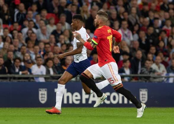 Football - 2018 2019 UEFA Nations League A - Group Four: England vs. Spain Marcus Rashford (England) and Sergio Ramos (Spain) race for the ball at Wembley Stadium. COLORSPORT DANIEL BEARHAM  csp_eng_spa_080918_