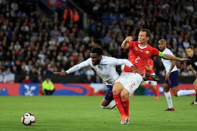 11th September 2018, King Power Stadium, Leicester, England; International Football Friendly, England versus Switzerland; Stephan Lichtsteiner of Switzerland fouls Danny Rose of England  ActionPlus12061769 ShaunxBrooks