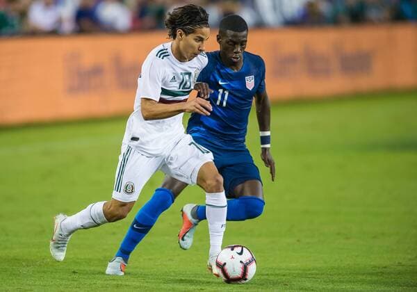 NASHVILLE, TN - SEPTEMBER 11: Mexico midfielder Diego Lainez (18) is defended by United States midfielder Tim Weah (11) during a match between the United States and Mexico on September 11, 2018, at Nissan Stadium in Nashville, TN. (Photo by Bryan Lynn Icon Sportswire) SOCCER: SEP 11 Mexico v USA Icon180911022 EDITORIAL USE ONLY