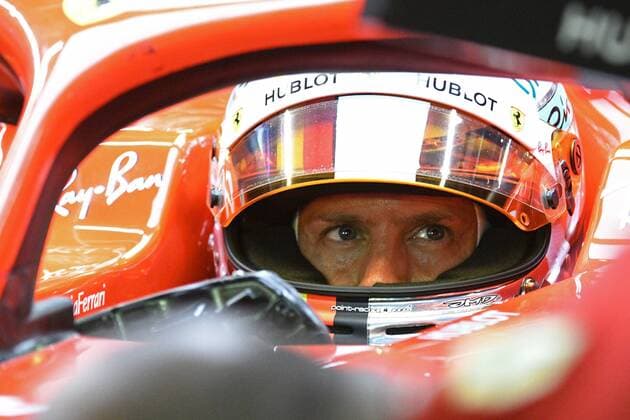(180915) -- SINGAPORE, Sept. 15, 2018 -- Ferrari driver Sebastian Vettel of Germany looks on in the second practise session of the Formula One Singapore Grand Prix Night Race held at the Marina Bay Street Circuit on Sept. 14, 2018. ) (SP)SINGAPORE-F1 GRAND PRIX NIGHT RACE-PRACTISE ThenxChihxWey 