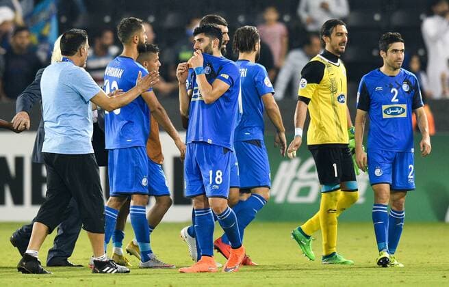 (180918) -- DOHA, Sept. 18, 2018 -- Players of Iran s Esteghlal FC react after the AFC Asian Champions League quarterfinal second leg football match between Qatar s Al Sadd and Iran s Esteghlal FC in Doha, capital of Qatar, Sept. 17, 2018. Al Sadd was qualified for the semifinal after a 2-2 draw in the second leg of the quarterfinal with Esteghlal FC gave them a 5-3 aggregate win. ) (SP)QATAR-DOHA-FOOTBALL-AFC-ASIAN CHAMPIONS LEAGUE Nikku 