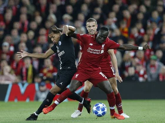 PSG forward Kylian Mbappe tussles with Liverpool midfielder Sadio Mane during the UEFA Champions League - Group C match at the Anfield Stadium, Liverpool. Picture date 18th September 2018. Picture credit should read: Andrew Yates Sportimage EDITORIAL USE ONLY. No use with unauthorised audio, video, data, fixture lists, club league logos or live services. Online in-match use limited to 120 images, no video emulation. No use in betting, games or single club league player publications.