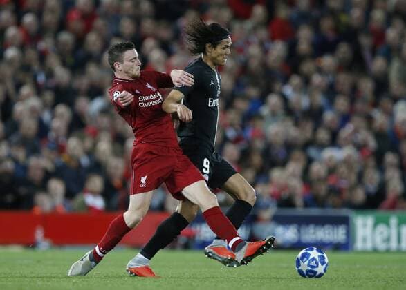 Liverpool defender Andy Robertson tackles PSG forward Edinson Cavani during the UEFA Champions League - Group C match at the Anfield Stadium, Liverpool. Picture date 18th September 2018. Picture credit should read: Andrew Yates Sportimage EDITORIAL USE ONLY. No use with unauthorised audio, video, data, fixture lists, club league logos or live services. Online in-match use limited to 120 images, no video emulation. No use in betting, games or single club league player publications.