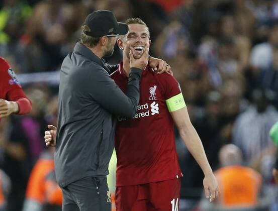 Liverpool manager Jurgen Klopp embraces Liverpool midfielder Jordan Henderson during the UEFA Champions League - Group C match at the Anfield Stadium, Liverpool. Picture date 18th September 2018. Picture credit should read: Andrew Yates Sportimage EDITORIAL USE ONLY. No use with unauthorised audio, video, data, fixture lists, club league logos or live services. Online in-match use limited to 120 images, no video emulation. No use in betting, games or single club league player publications.