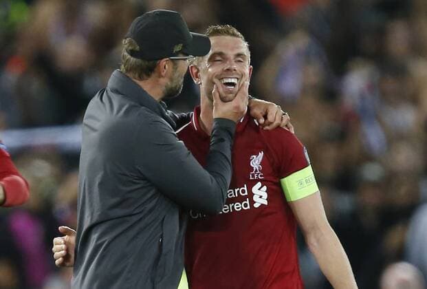 Liverpool manager Jurgen Klopp embraces Liverpool midfielder Jordan Henderson during the UEFA Champions League - Group C match at the Anfield Stadium, Liverpool. Picture date 18th September 2018. Picture credit should read: Andrew Yates Sportimage EDITORIAL USE ONLY. No use with unauthorised audio, video, data, fixture lists, club league logos or live services. Online in-match use limited to 120 images, no video emulation. No use in betting, games or single club league player publications.