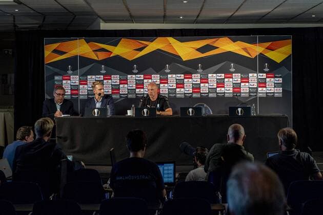180919 Press officer Fredrik Stjernström and head coach Uwe Rösler of Malmö FF during a practice and press conference PK Pressekonferenz with Malmö FF ahead of the Europa League match against Genk on September 19, 2018 in Genk. Photo: Ludvig Thunman BILDBYRN kod LT 35537 Copyright: LUDVIGxTHUNMAN BB180919LT019