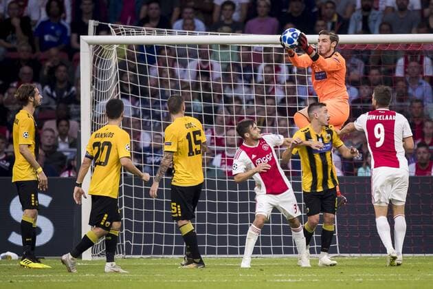 AMSTERDAM, AFC Ajax - AEK Athens FC, football, Champions League, season 2018-2019, 19-09-2018, Stadium Johan Cruijff Arena, AEK Athens goalkeeper Vassilis Barkas (2R) grabs the ball, Ajax player Nico Tagliafico (M), Ajax player Klaas Jan Huntelaar (R) Ajax - AEK Athens  x2476635x
