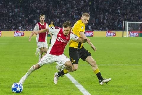 AMSTERDAM, Johan Cruijff Arena, 19-09-2018 , season 2018 2019 , UEFA Champions League. final result 3-0, Ajax player Nico Tagliafico (L) with AEK Athens player Michalis Bakakis (R) during the match Ajax - AEK Athens Ajax - AEK Athens  x2477095x