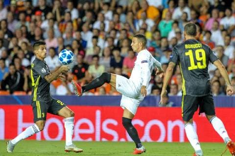 19th September 2018, Mestalla, Valencia, Spain; UEFA Champions League football, Valencia versus Juventus; Rodrigo of Valencia controls the ball ahead of Joao Cancelo of Juventus Turin  ActionPlus12063819 PedroxSalado