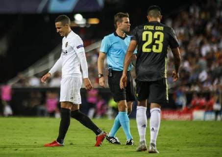 Rodrigo and Emre Can during the football match between Valencia CF and Juventus FC on September 19, 2018 at Mestalla stadium in Valencia, Spain.