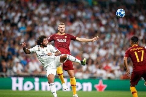 September 19, 2018 - Marcelo of Real Madrid and Edin Dzeko of Roma during the Champions League football match between Real Madrid and AS Roma on September 19th, 2018 at Santiago Bernabeu stadium in Madrid, Spain. Soccer: Champions League - Real Madrid v AS Roma - ZUMAa181 20180919_zaa_a181_056 Copyright: xAFP7x