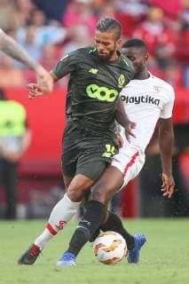 Standard s captain Mehdi Carcela and Sevilla s midfielder Ibrahim Amadou fight for the ball during a match between Belgian soccer team Standard de Liege and Spanish club Sevilla FC, Thursday 20 September 2018 in Sevilla, Spain, on day one of the UEFA Europa League group stage. BRUNOxFAHY  x05430076x
