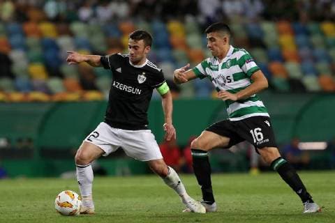 September 20, 2018 - Lisbon, Portugal - Qarabag s defender Gara Garayev (L) vies with Sporting s midfielder Rodrigo Battaglia from Argentina during the UEFA Europa League Group E football match Sporting CP vs Qarabag at Alvalade stadium in Lisbon, on September 20, 2018. UEFA Europa League Group E football match Sporting CP vs Qarabag - ZUMAf123 20180920_zap_f123_020 Copyright: xPedroxFiuzax