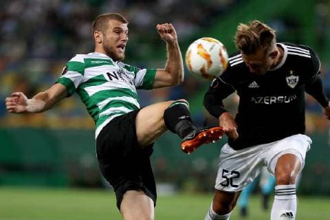 September 20, 2018 - Lisbon, Portugal - Sporting s defender Stefan Ristovsk from Macedonia (L) fights for the ball with Qarabag s defender Jakub Rzezniczak during the UEFA Europa League Group E football match Sporting CP vs Qarabag at Alvalade stadium in Lisbon, on September 20, 2018. Sporting CP v Qarabag FK - UEFA Europa League - Group E  - ZUMAn230 20180920_zaa_n230_301 Copyright: xPedroxFiuzax