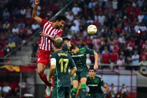 UEFA Europa League: Olympiacos vs Betis Ahmed Hassan (no 18) of Olympiacos attempt to score under the pressure of Real Betis defence. Piraeus Attiki Greece Stadio Georgios Karaiskakis  DimitriosxKarvountzis PacificxPress