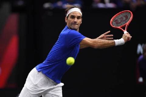 CHICAGO, IL - SEPTEMBER 21: Team Europe Roger Federer of Switzerland returns the ball against Team World Jack Sock of the United States and Team World Kevin Anderson of South Africa during their Men s Doubles match on day one of the 2018 Laver Cup at the United Center on September 21, 2018 in Chicago, Illinois.(Photo by Robin Alam Icon Sportswire) TENNIS: SEP 21 Laver Cup Icon164180921117 EDITORIAL USE ONLY