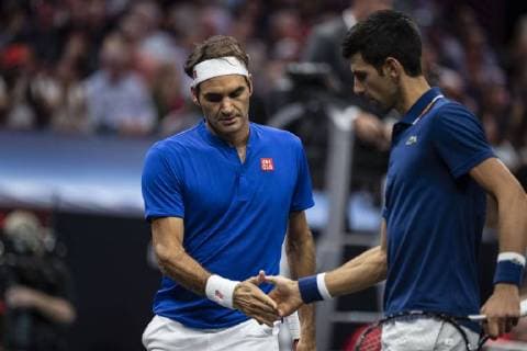 September 21, 2018 - Chicago, Illinois, U.S - Team Europe member ROGER FEDERER of Switzerland gives high fives to his teammate NOVAK DJOKOVIC of Serbia during the first doubles match on Day One of the Laver Cup at the United Center in Chicago, Illinois. Laver Cup Day 1 - ZUMAl140 20180921_zap_l140_134 Copyright: xShelleyxLiptonx