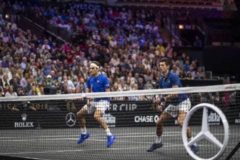 September 21, 2018 - Chicago, Illinois, U.S - Team Europe member ROGER FEDERER of Switzerland and partner NOVAK DJOKOVIC of Serbia play at the net during the first doubles match on Day One of the Laver Cup at the United Center in Chicago, Illinois. Laver Cup Day 1 - ZUMAl140 20180921_zap_l140_150 Copyright: xShelleyxLiptonx
