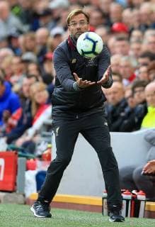 Sport Bilder des Tages 22nd September 2018, Anfield, Liverpool, England; EPL Premier League football, Liverpool versus Southampton; Jurgen Klopp, Liverpool manager gathers a stray ball as it is deflected into the technical area  ActionPlus12064817 DavidxBlunsden