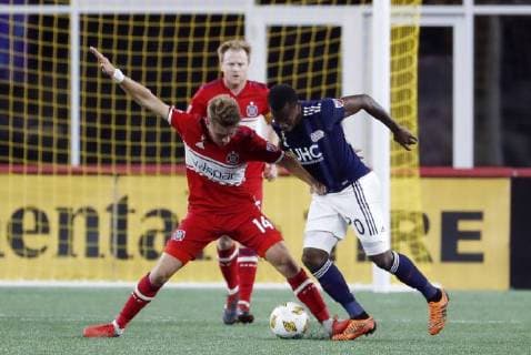 FOXBOROUGH, MA - SEPTEMBER 22: Chicago Fire midfielder Djordje Mihailovic (14) holds off New England Revolution forward Cristian Penilla (70) during a match between the New England Revolution and the Chicago Fire on September 22, 2018, at Gillette Stadium in Foxborough, Massachusetts. The teams played to a 2-2 draw. (Photo by Fred Kfoury III Icon Sportswire) SOCCER: SEP 22 MLS Fussball Herren USA - Chicago Fire at New England Revolution Icon482180922007 EDITORIAL USE ONLY
