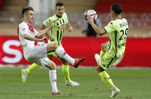 (180926) -- FONTVIEILLE, Sept. 26, 2018 (Xinhua) -- Vincent Manceau (R) of Angers vies with Aleksandr Golovin of Monaco during the French Ligue 1 seventh round match between Angers and Monaco in Fontvieille, Monaco on Sept. 25, 2018. Angers won 1-0. (Xinhua Marco Fino) (SP)MONACO-FONTVIEILLE-FOOTBALL-LIGUE 1-ANGERS VS MONACO 