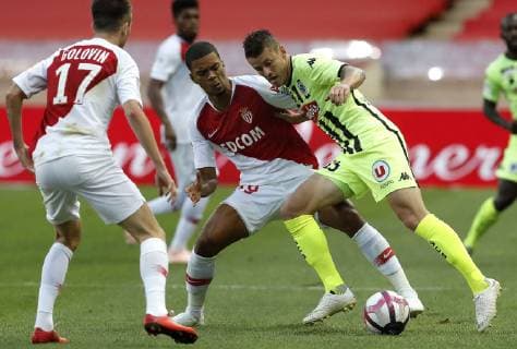 (180926) -- FONTVIEILLE, Sept. 26, 2018 (Xinhua) -- Pierrick Capelle (R) of Angers vies with Benjamin Henrichs of Monaco during the French Ligue 1 seventh round match between Angers and Monaco in Fontvieille, Monaco on Sept. 25, 2018. Angers won 1-0. (Xinhua Marco Fino) (SP)MONACO-FONTVIEILLE-FOOTBALL-LIGUE 1-ANGERS VS MONACO 
