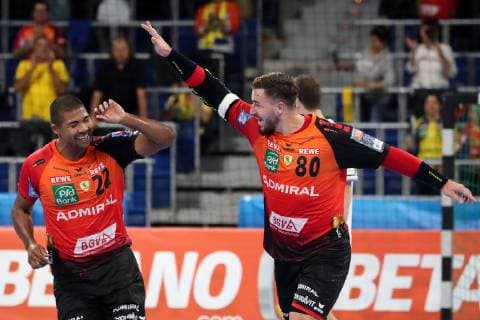 v.li.: Mads Mensah Larsen (RNL, 22), Jannik Kohlbacher (RNL, 80), jubeln über ein Tor, Jubel, Torjubel, Torerfolg, celebrate the goal, goal, celebration, Jubel ueber das Tor, optimistisch, Action, Aktion, Handball, Champions League, Rhein-Neckar Löwen - HC Meshkov Brest,