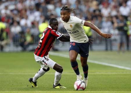 (180930) -- NICE, Sept. 30, 2018 -- Christopher Nkunku (R) of Paris Saint-Germain vies with Racine Coly of Nice during the 2018-2019 season French Ligue 1 match between Paris Saint-Germain and Nice in Nice, France on Sept. 29, 2018. Paris Saint-Germain won 3-0. ) (SP)FRANCE-NICE-FOOTBALL-LIGUE 1-PARIS SAINT-GERMAIN VS NICE ChristophexPetino 
