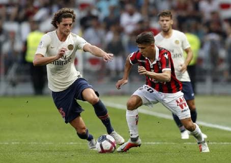(180930) -- NICE, Sept. 30, 2018 -- Adrien Rabiot (L) of Paris Saint-Germain vies with Youcef Atal of Nice during the 2018-2019 season French Ligue 1 match between Paris Saint-Germain and Nice in Nice, France on Sept. 29, 2018. Paris Saint-Germain won 3-0. ) (SP)FRANCE-NICE-FOOTBALL-LIGUE 1-PARIS SAINT-GERMAIN VS NICE ChristophexPetino 