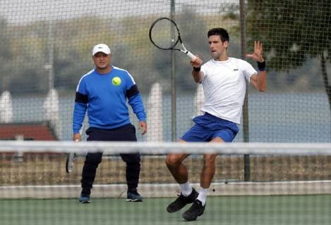 (181001) -- BELGRADE, Oct. 1, 2018 -- Serbia s tennis player Novak Djokovic (R) returns the ball, while his coach Marian Vajda looks on during an open training session in Belgrade, Serbia on Oct. 1, 2018. ) (SP)SERBIA-BELGRADE-TENNIS-DJOKOVIC-TRAINING PredragxMilosavljevic 