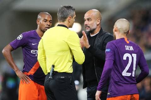 02.10.2018, xtvx, Fussball UEFA Champions League, TSG 1899 Hoffenheim - Manchester City FC emspor, v.l. Schiedsrichter Damir Skomina Trainer Pep Guardiola (Manchester City) Portrait (DFL DFB REGULATIONS PROHIBIT ANY USE OF PHOTOGRAPHS as IMAGE SEQUENCES and or QUASI-VIDEO) Sinsheim