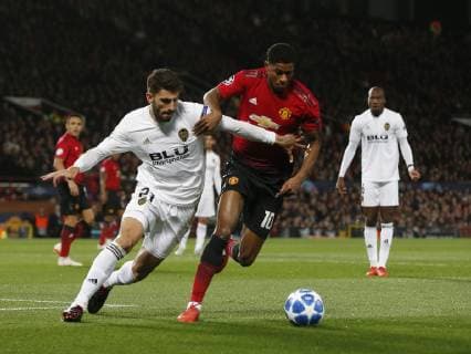 Cristiano Piccini of Valencia tacked by Markus Rashford of Manchester United ManU during the UEFA Champions League Group H match at Old Trafford Stadium, Manchester. Picture date: 2nd September 2018. Picture credit should read: Andrew Yates Sportimage EDITORIAL USE ONLY. No use with unauthorised audio, video, data, fixture lists, club league logos or live services. Online in-match use limited to 120 images, no video emulation. No use in betting, games or single club league player publications.