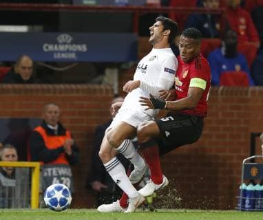 Antonio Valencia of Manchester United ManU clatters into Goncalo Guedes of Valencia during the UEFA Champions League Group H match at Old Trafford Stadium, Manchester. Picture date: 2nd September 2018. Picture credit should read: Andrew Yates Sportimage EDITORIAL USE ONLY. No use with unauthorised audio, video, data, fixture lists, club league logos or live services. Online in-match use limited to 120 images, no video emulation. No use in betting, games or single club league player publications.