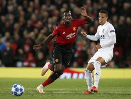 Paul Pogba of Manchester United ManU runs past Rodrigo of Valencia during the UEFA Champions League Group H match at Old Trafford Stadium, Manchester. Picture date: 2nd September 2018. Picture credit should read: Andrew Yates Sportimage EDITORIAL USE ONLY. No use with unauthorised audio, video, data, fixture lists, club league logos or live services. Online in-match use limited to 120 images, no video emulation. No use in betting, games or single club league player publications.