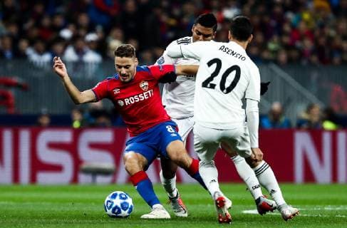 MOSCOW, RUSSIA - OCTOBER 2, 2018: CSKA Moscow s Nikola Vlasic, Real Madrid s Casemiro and Marco Asensio (L-R) fight for the ball in their 2018 19 UEFA Champions League Group G Round 2 football match at Luzhniki Stadium. Anton Novoderezhkin TASS  TS0923CF