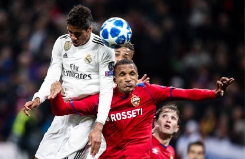 MOSCOW, RUSSIA - OCTOBER 2, 2018: Real Madrid s Raphael Varane (L) and CSKA Moscow s Rodrigo Becao head the ball in their 2018 19 UEFA Champions League Group G Round 2 football match at Luzhniki Stadium. Valery Sharifulin TASS  TS09240A