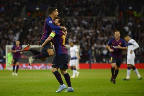 Coutinho celebrates after scoring his sides first goal whit Lionel Messi of Barcelona Group B match of the UEFA Champions League between Tottenham Hotspurs and FC Barcelona Barca at Wembley Stadium on October 03, 2018 in London, England.
