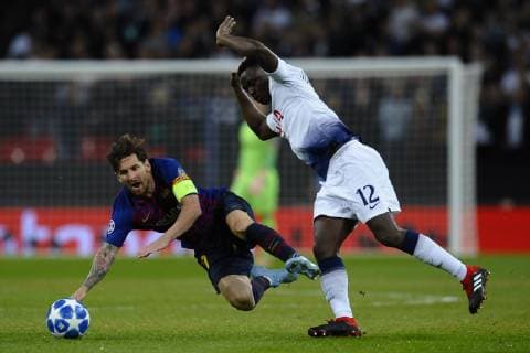 Lionel Messi of Barcelona and Victor Wanyama of Tottenham Group B match of the UEFA Champions League between Tottenham Hotspurs and FC Barcelona Barca at Wembley Stadium on October 03, 2018 in London, England.