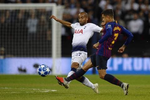 Lucas of Tottenham and Coutinho of Barcelona battle for the ball during the Group B match of the UEFA Champions League between Tottenham Hotspurs and FC Barcelona Barca at Wembley Stadium on October 03, 2018 in London, England.