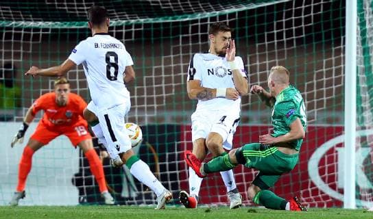 04.10.2018 Poltava(Ukraine) FC Vorskla-Sporting CP Europa League men s football Vladyslav Kulach(R) FC Vorskla scoring first goal beside Sebastian Coates (2nd from right) Sporting CP :Str 
