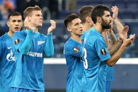 ST PETERSBURG, RUSSIA â€“ OCTOBER 4, 2018: FC Zenit St Petersburg s Alexander Kokorin (2nd L) and Luis Neto (R) celebrate winning their 2018 19 UEFA Europa League Group C Round 2 football match against FC Slavia Praha at Saint Petersburg Stadium. FC Zenit won the game 1:0. Peter Kovalev TASS  TS092909