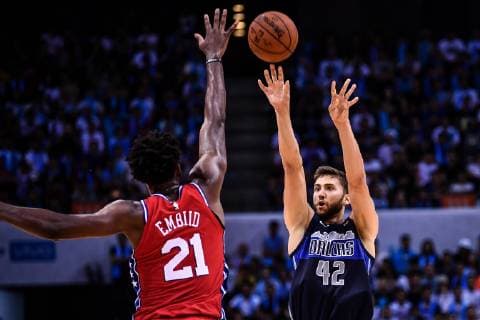 Joel Embiid of Philadelphia 76ers, left, jumps to block a shot by Maxi Kleber of Dallas Mavericks during the Shenzhen match of the NBA Basketball Herren USA China Games in Shenzhen city, south China s Guangdong province, 8 October 2018. Mavericks beat 76ers 115-112 at Shenzhen match of NBA China Games. Dallas tops 76ers 115-112 at Shenzhen match of NBA China Games  20181008_55584