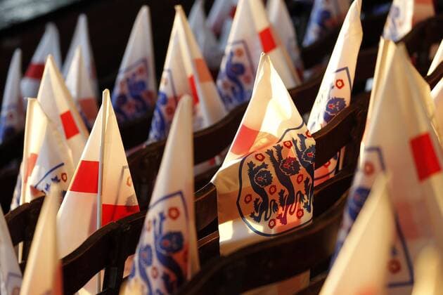 England flags backlit by the sunset seen during the Women s International Friendly L?nderspiel match between England Women and Australia at Craven Cottage, London, England on 9 October 2018. Copyright: xCarltonxMyriex PMI-2301-0052
