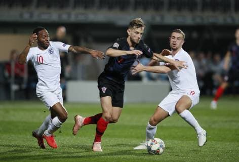 Ivan Rakitic of Croatia runs through Raheem Sterling and Jordan Henderson of England during the Uefa Nations League, Group A4 match at Stadion HNK Rijeka, Rijeka. Picture date: 12th October 2018. Picture credit should read: David Klein Sportimage EDITORIAL USE ONLY. No use with unauthorised audio, video, data, fixture lists, club league logos or live services. Online in-match use limited to 120 images, no video emulation. No use in betting, games or single club league player publications.
