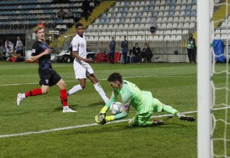 Dominik Livakovic of Croatia dives on shot by Marcus Rashford of England during the Uefa Nations League, Group A4 match at Stadion HNK Rijeka, Rijeka. Picture date: 12th October 2018. Picture credit should read: David Klein Sportimage EDITORIAL USE ONLY. No use with unauthorised audio, video, data, fixture lists, club league logos or live services. Online in-match use limited to 120 images, no video emulation. No use in betting, games or single club league player publications.