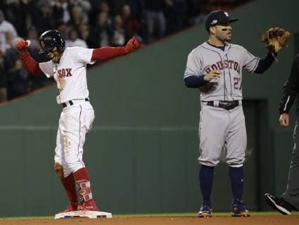 Sport Themen der Woche KW41 Sport Bilder des Tages Boston Red Sox Mookie Betts (R) celebrates after doubling home a run against Houston Astros second baseman Jose Altuve during the eighth inning in game two of the American League Championship Series at Fenway Park in Boston, Massachusetts on October 14, 2018. The Astros hold a 1-0 series lead over the Red Sox.  BOS2018101441 JOHNxANGELILLO