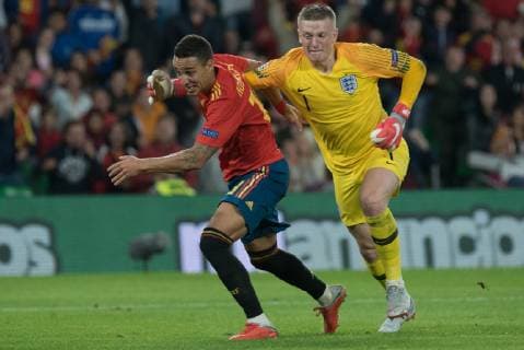 Spain: UEFA Nations League between Spain and Engla Rodrigo, Spain, and Jordan Pickford fight for the ball during the match between Spain and England in Benito Villamarin Stadium in Seville. Sevilla Spain  JavierxMontanox xPacificxPress